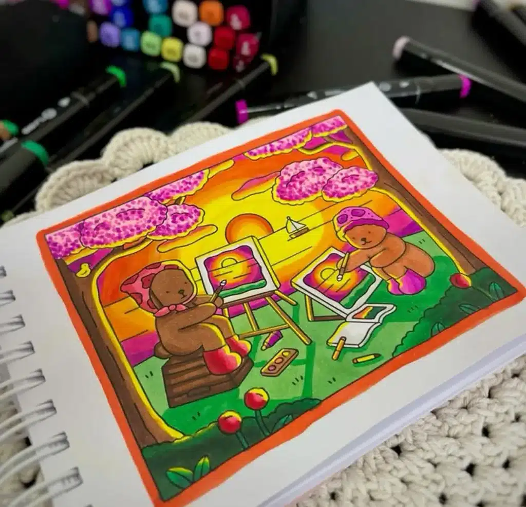 Ilustração colorida de dois ursinhos pintando ao ar livre, sob flores de cerejeira com o pôr do sol ao fundo, representando a importância da arte na redução de estresse.