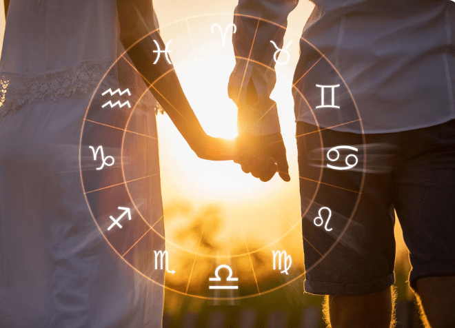 Casal de mãos dadas com símbolos do zodíaco sobrepostos