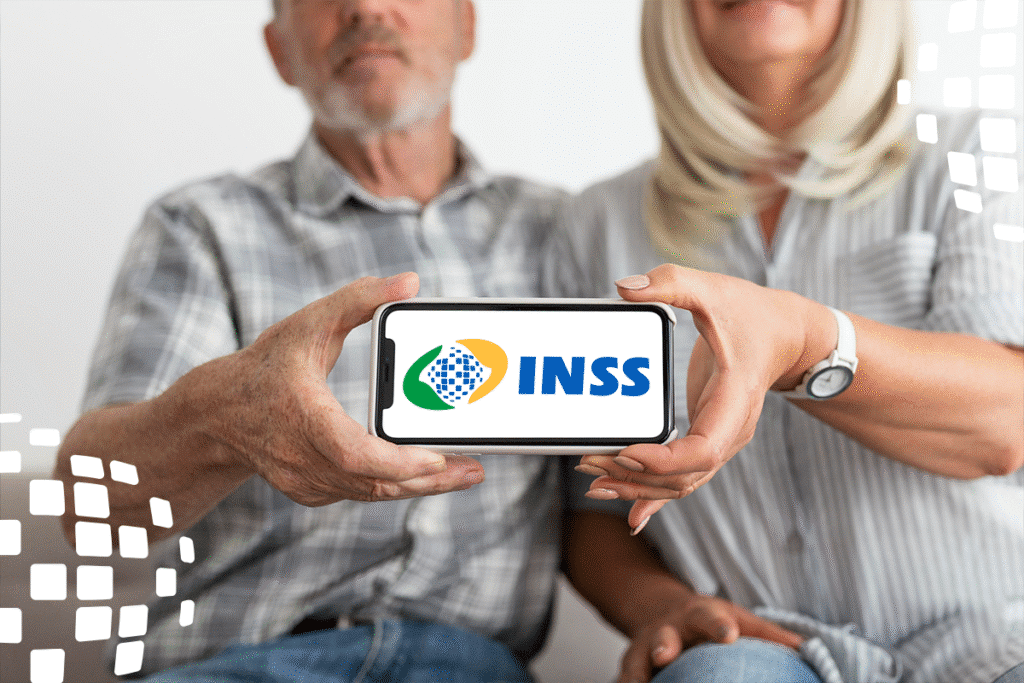 Casal segurando celular com logo do INSS na tela