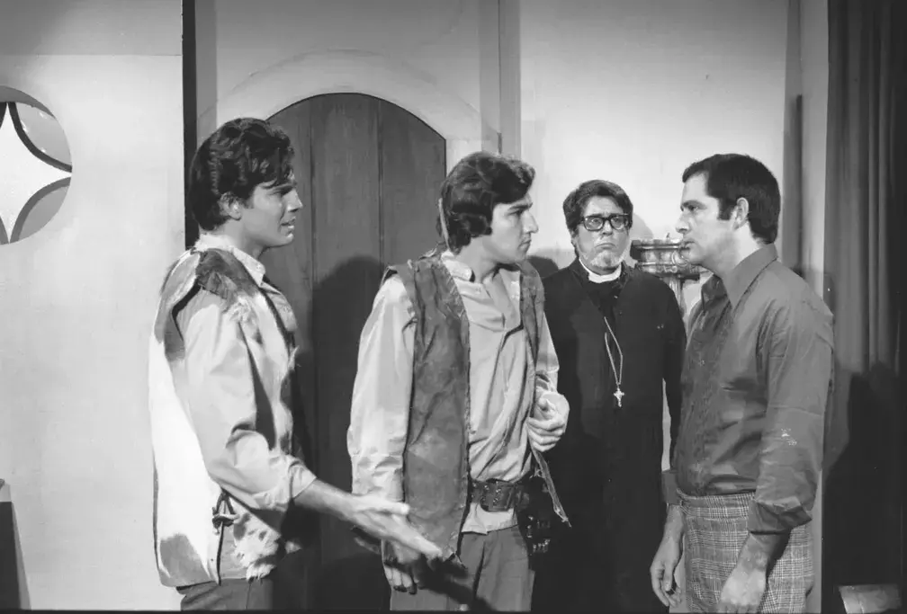 Cena de 'Irmãos Coragem', exibida em 1970, com personagens João, Jerônimo, e Duda em um momento tenso.
