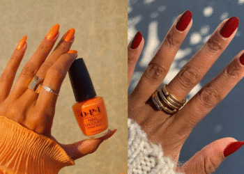 cDuas mãos exibindo esmaltes de cores vibrantes: uma com esmalte laranja intenso e outra com esmalte vermelho vinho escuro, indicando tendências para o fim de ano.