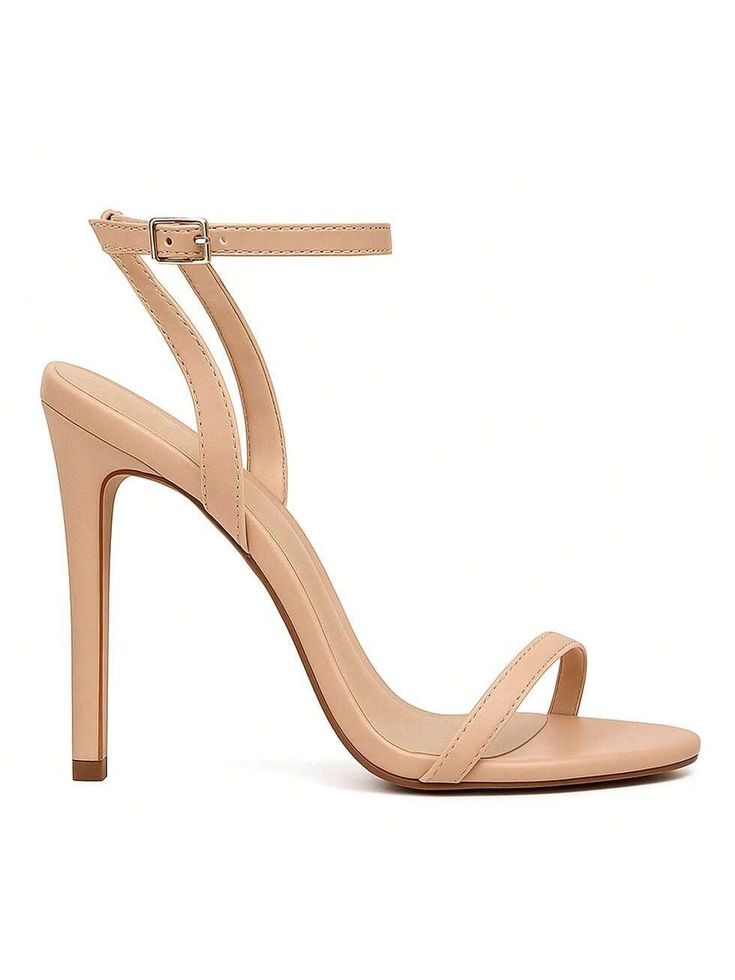 Sandália de salto alto fino e cor nude com tiras delicadas, ideal para alongar as pernas. O modelo minimalista é popular para um visual elegante em 2025.