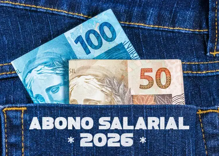 Cédulas de 100 e 50 reais em bolso de jeans destacado com frase abono salarial 2026