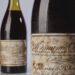 Duas garrafas de vinho francês Domaine de la Romanée-Conti, safra 1945, com rótulos antigos e envelhecidos.