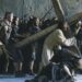 Cena cinematográfica da Via Crucis com Jesus carregando a cruz de madeira no ombro, cercado por soldados romanos em armaduras brônzeas e multidão ao fundo.