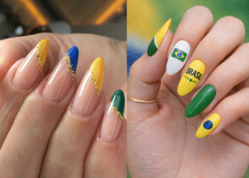 Duas mãos com unhas decoradas para a Copa. À esquerda, unhas amendoadas nude com pontas diagonais em amarelo, azul e verde, separadas por detalhes em folha de ouro. À direita, unhas com esmalte amarelo e verde, incluindo uma unha branca com a bandeira do Brasil e outra amarela com a escrita "BRASIL" em letras pretas.